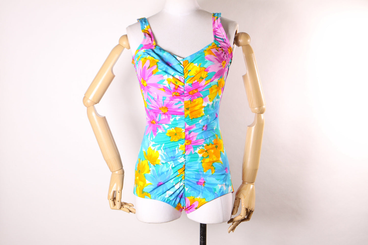 Late 1970s Early 1980s Blue, Pink and Orange Floral Ruched One Piece Swimsuit by Maxine of Hollywood -M-L