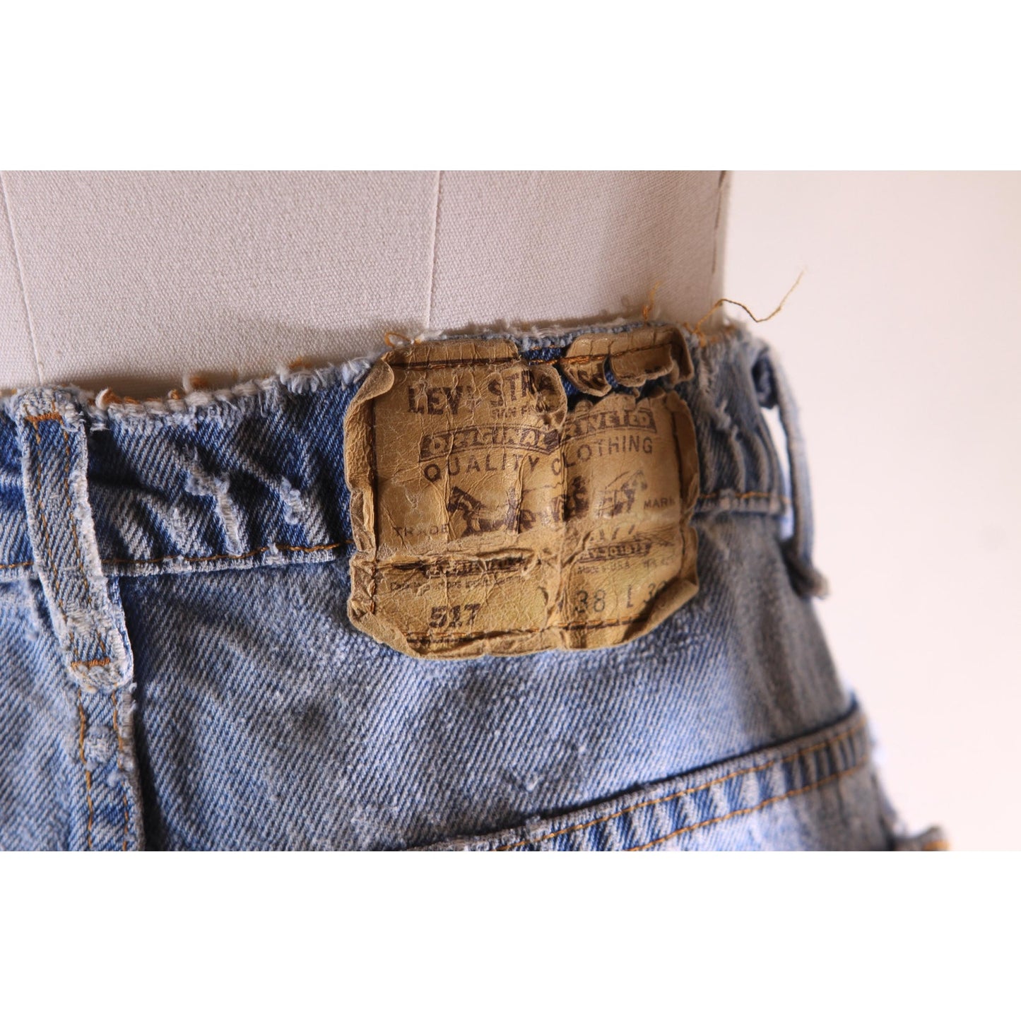 1980s Distressed Patch Fraying Blue Denim Orange Tab 517 Jeans by Levi's -38x30