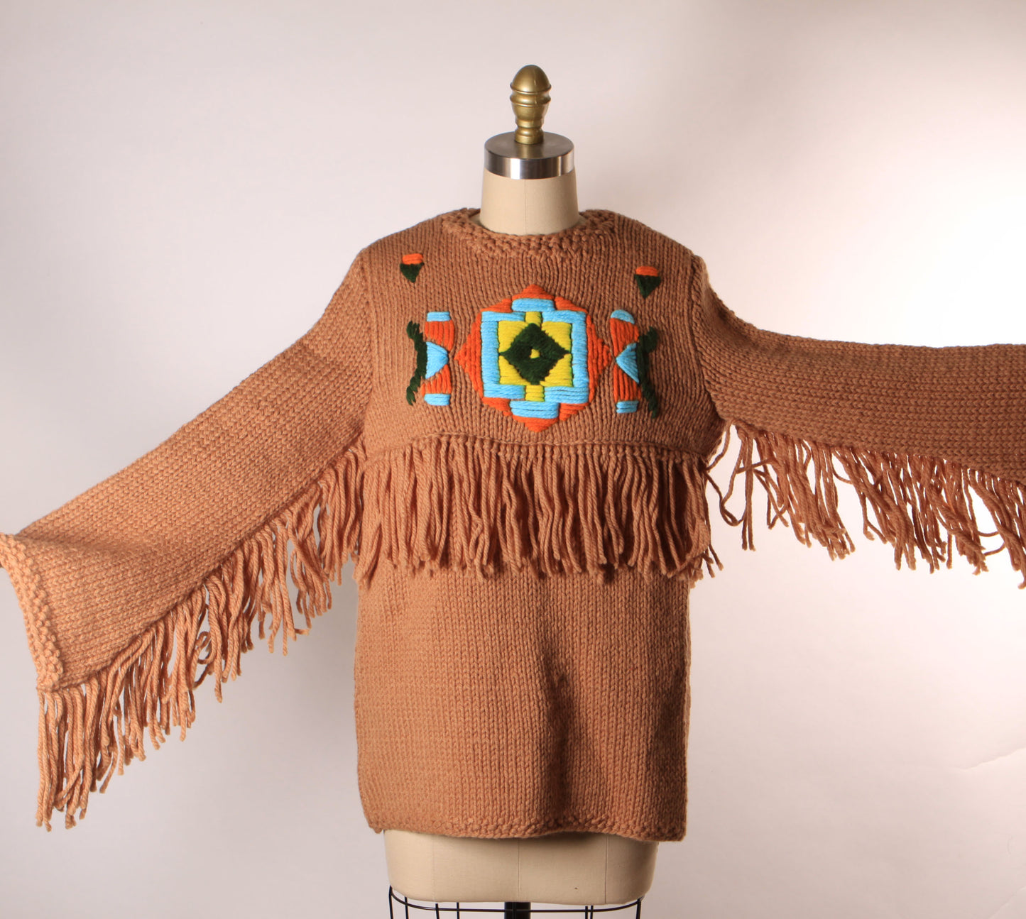 Late 1960s Early 1970s Tan, Blue, Black and Yellow Western Native American Fringe Sleeve Knit Sweater