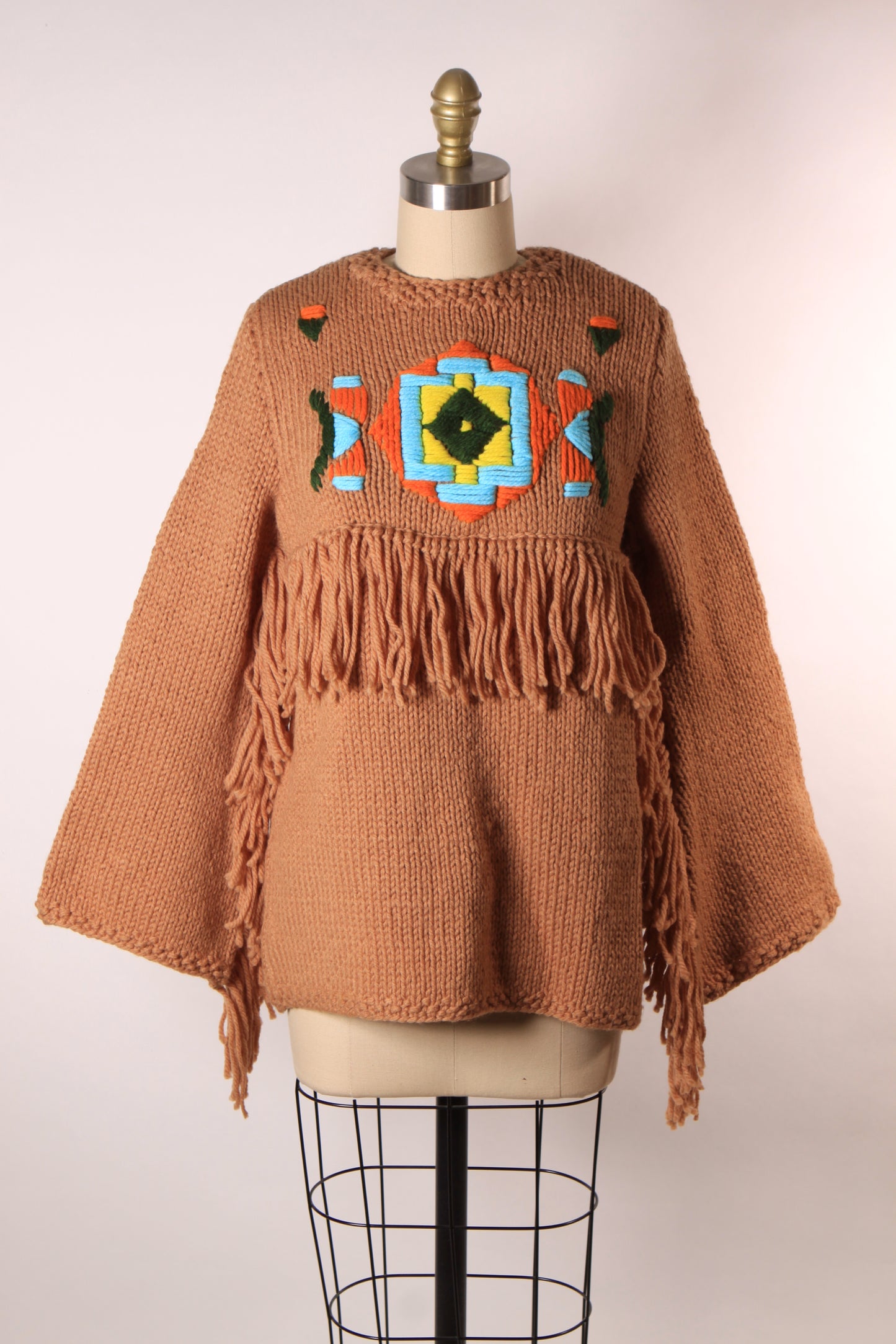 Late 1960s Early 1970s Tan, Blue, Black and Yellow Western Native American Fringe Sleeve Knit Sweater