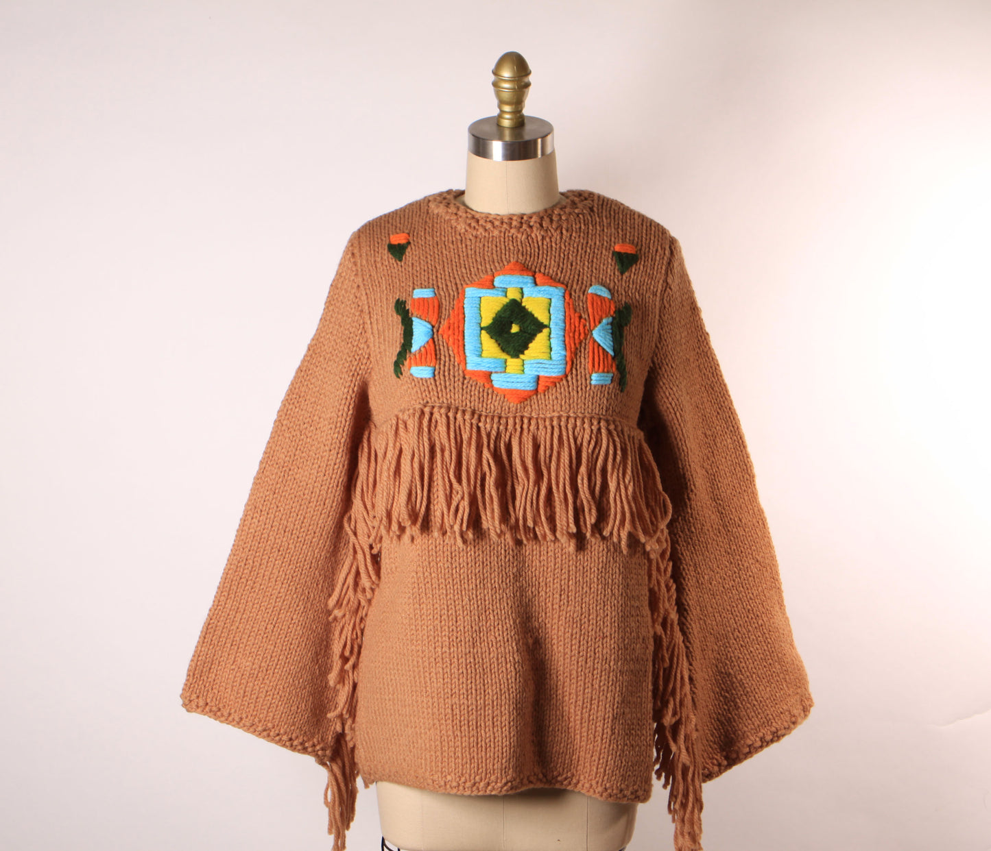 Late 1960s Early 1970s Tan, Blue, Black and Yellow Western Native American Fringe Sleeve Knit Sweater