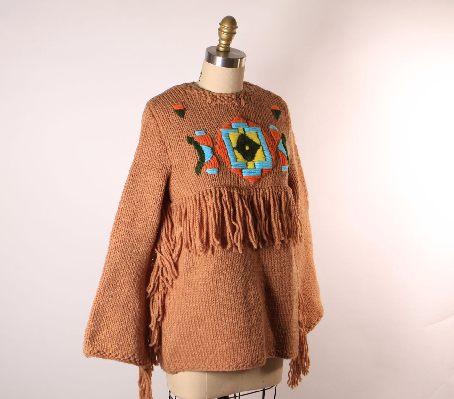 Late 1960s Early 1970s Tan, Blue, Black and Yellow Western Native American Fringe Sleeve Knit Sweater