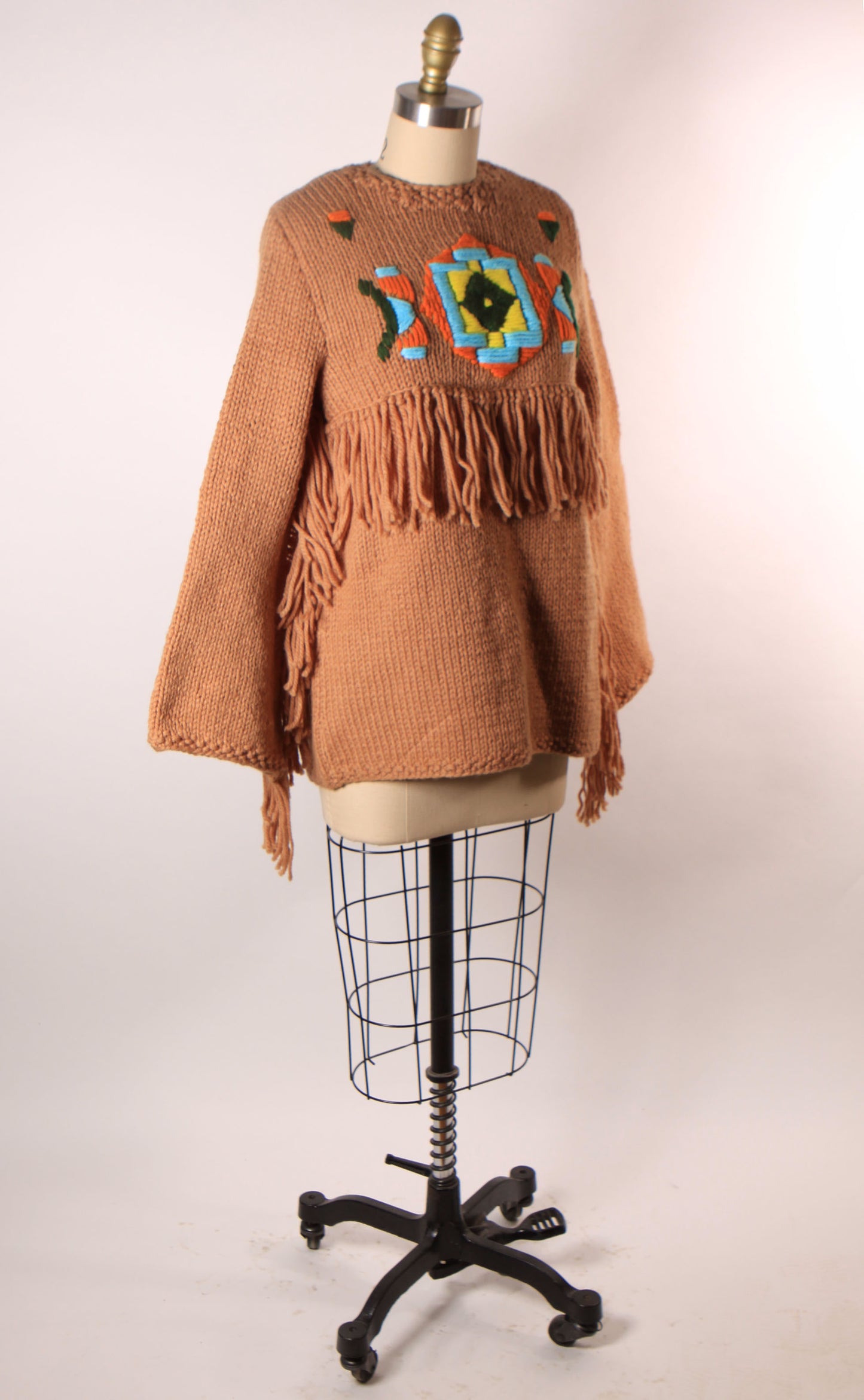 Late 1960s Early 1970s Tan, Blue, Black and Yellow Western Native American Fringe Sleeve Knit Sweater