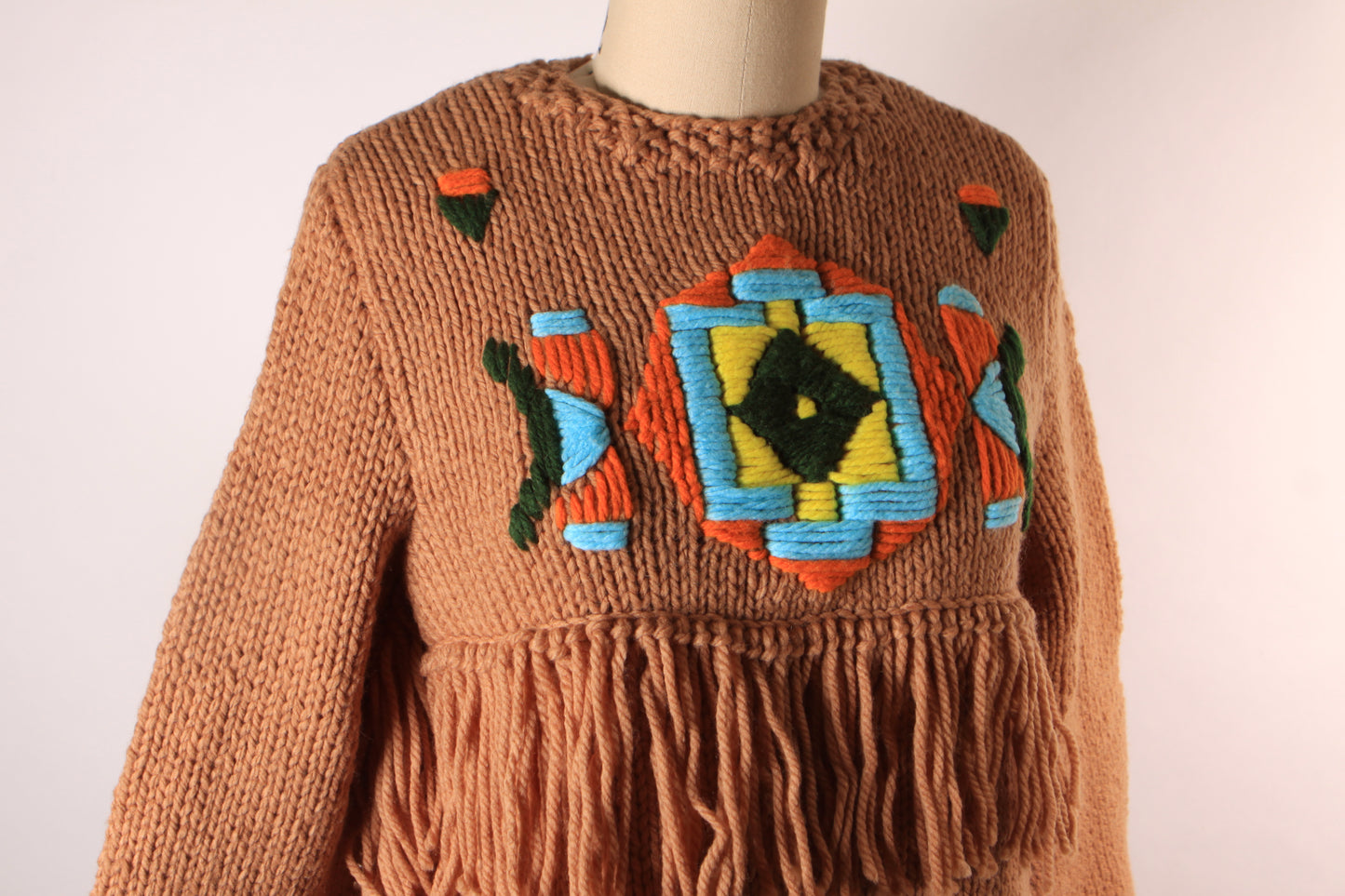 Late 1960s Early 1970s Tan, Blue, Black and Yellow Western Native American Fringe Sleeve Knit Sweater