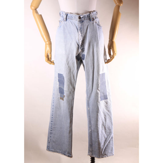 1980s Distressed Patch Fraying Blue Denim Orange Tab 517 Jeans by Levi's -38x29