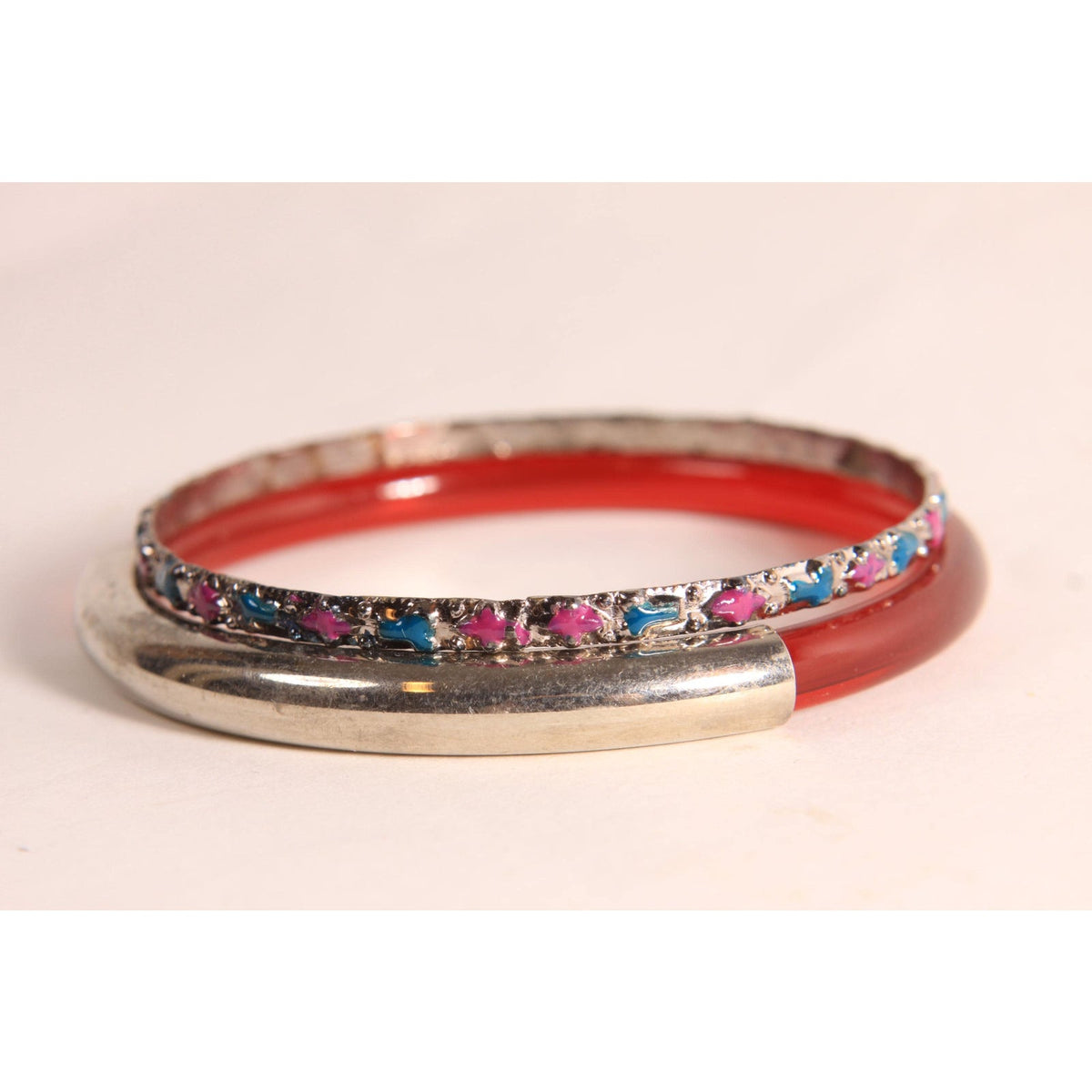1970s 1980s Dark Red and Silver Tone Metal and Plastic and Metal Hot Pink and Blue Stack of Bangle Bracelets