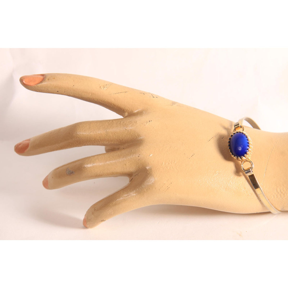 1970s Silver Tone and Gold Tone Metal Blue Faux Stone Bracelet by Avon