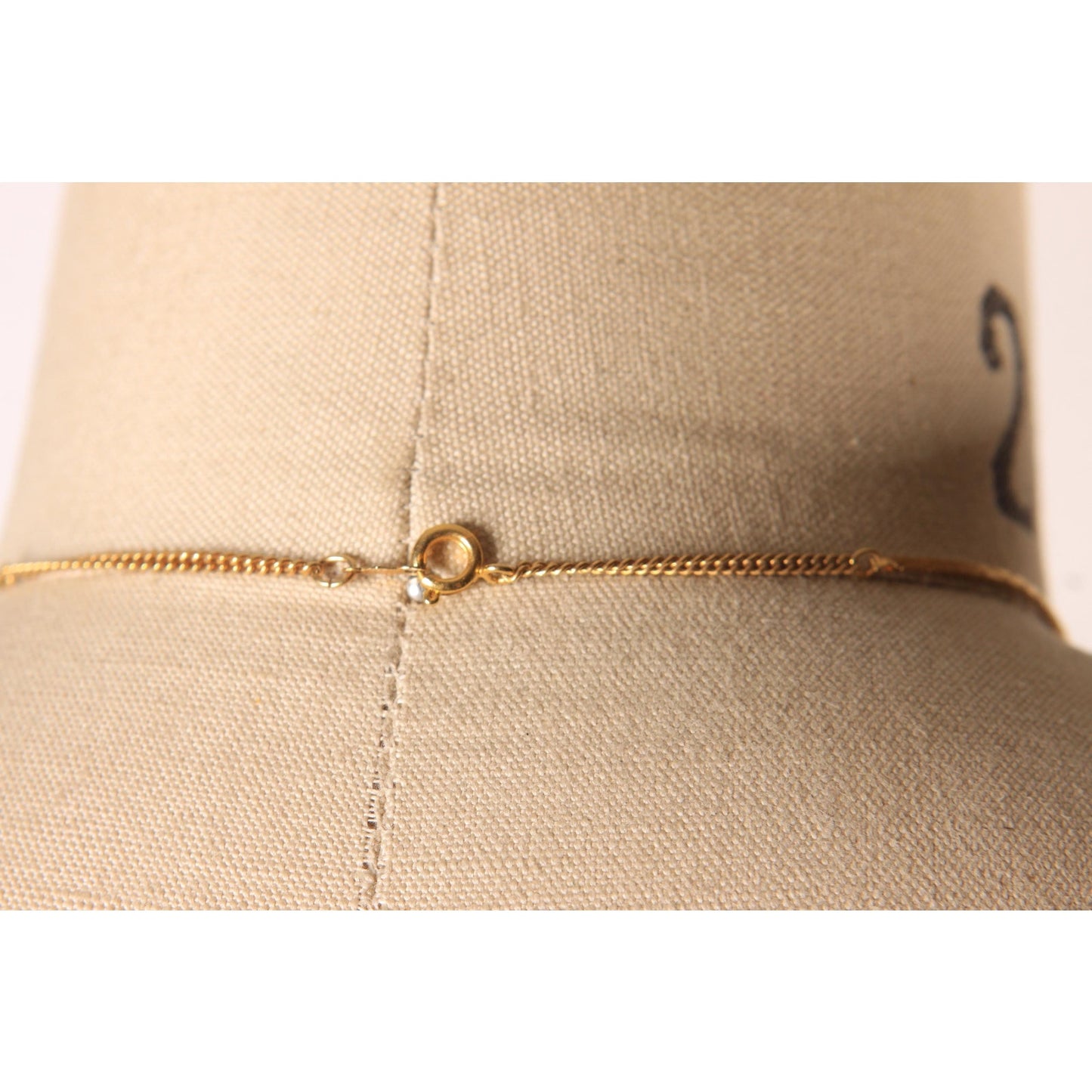 1970s Gold Tone Metal V Shape Pendant Rhinestone Faux Stone Necklace