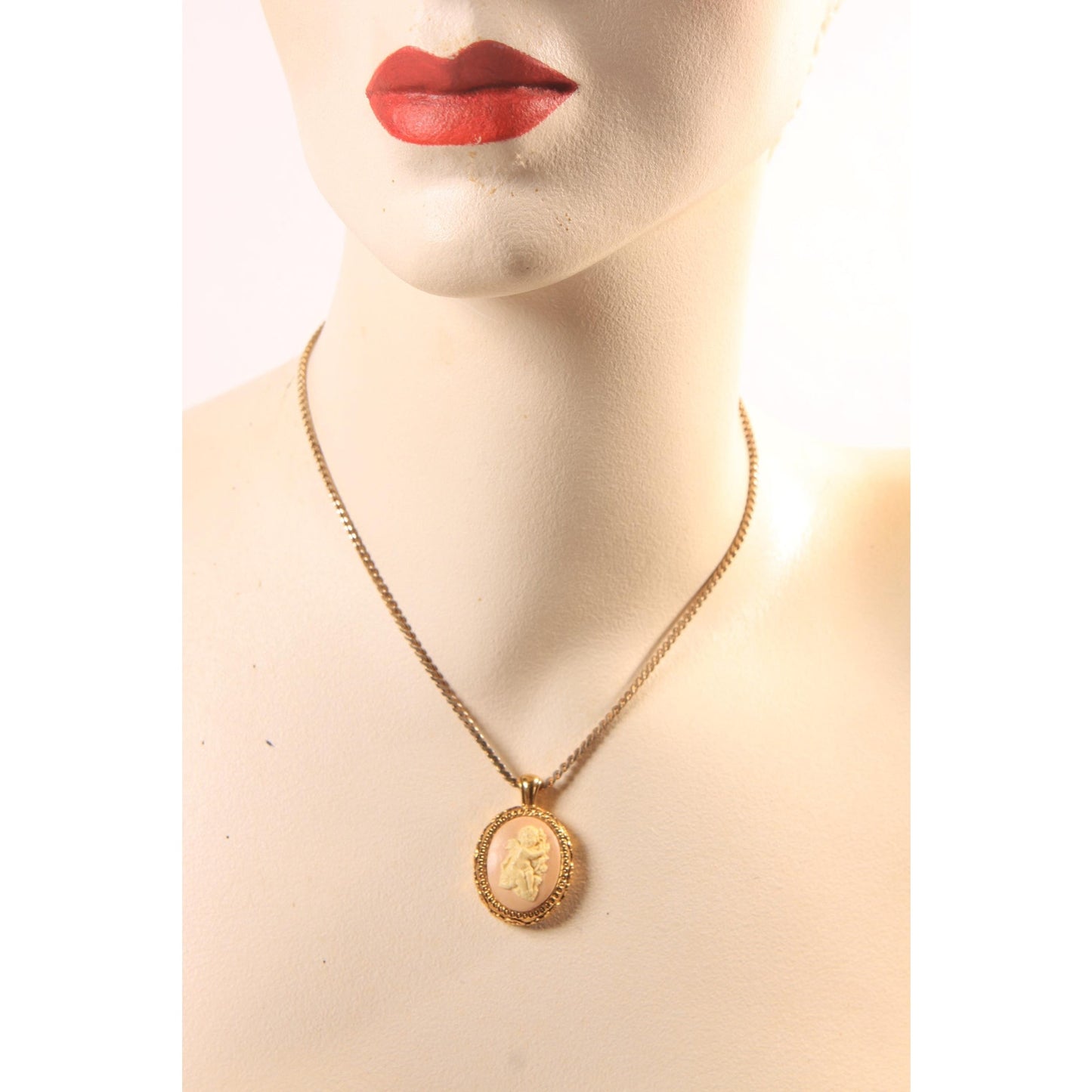 1970s Gold Tone Metal Pink and Cream Cherub Cameo Pendant Necklace