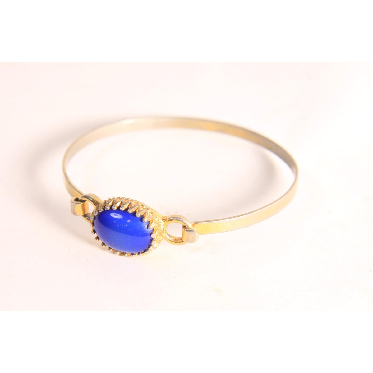 1970s Silver Tone and Gold Tone Metal Blue Faux Stone Bracelet by Avon