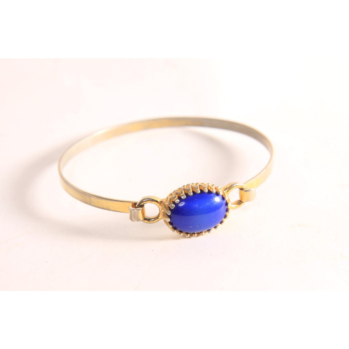 1970s Silver Tone and Gold Tone Metal Blue Faux Stone Bracelet by Avon
