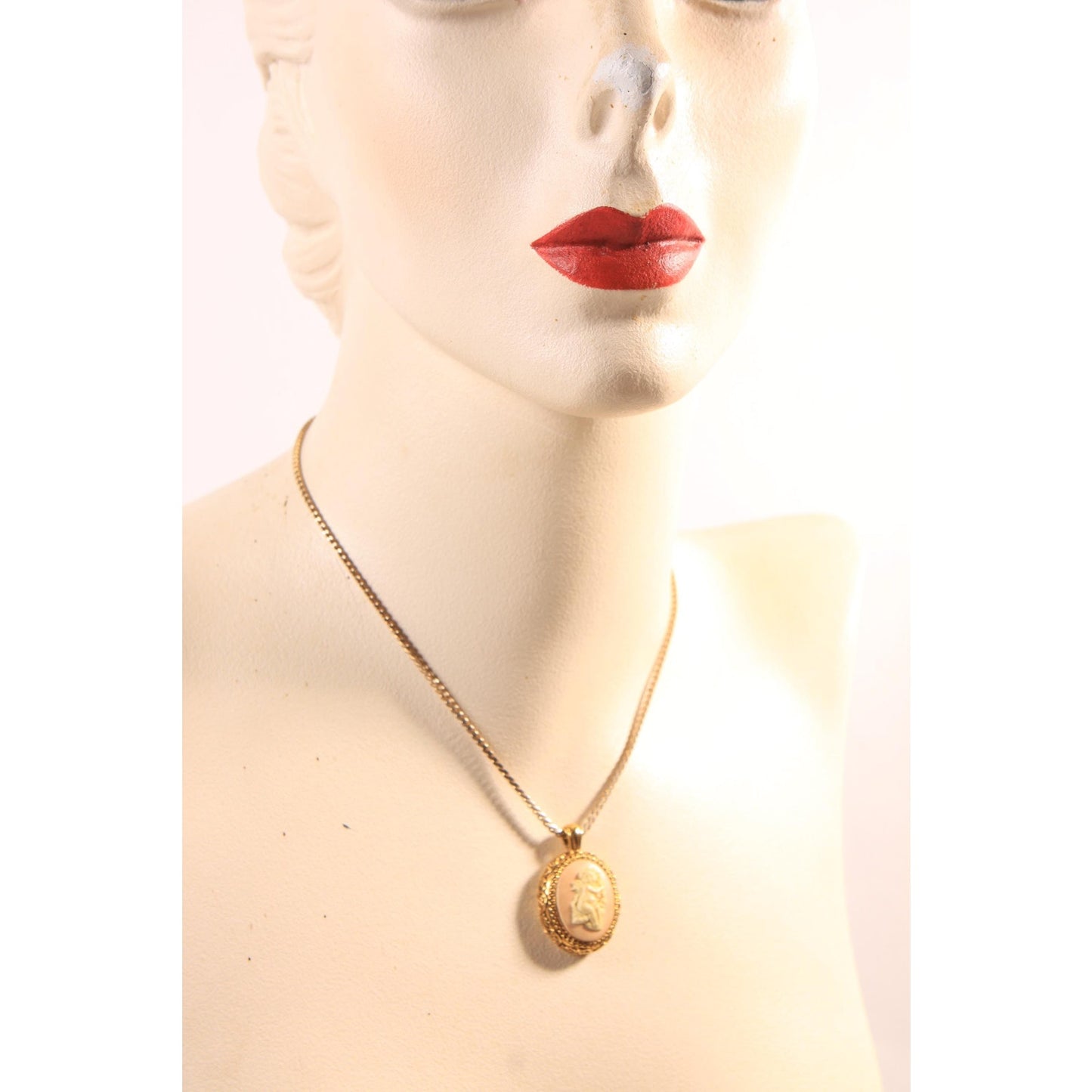 1970s Gold Tone Metal Pink and Cream Cherub Cameo Pendant Necklace