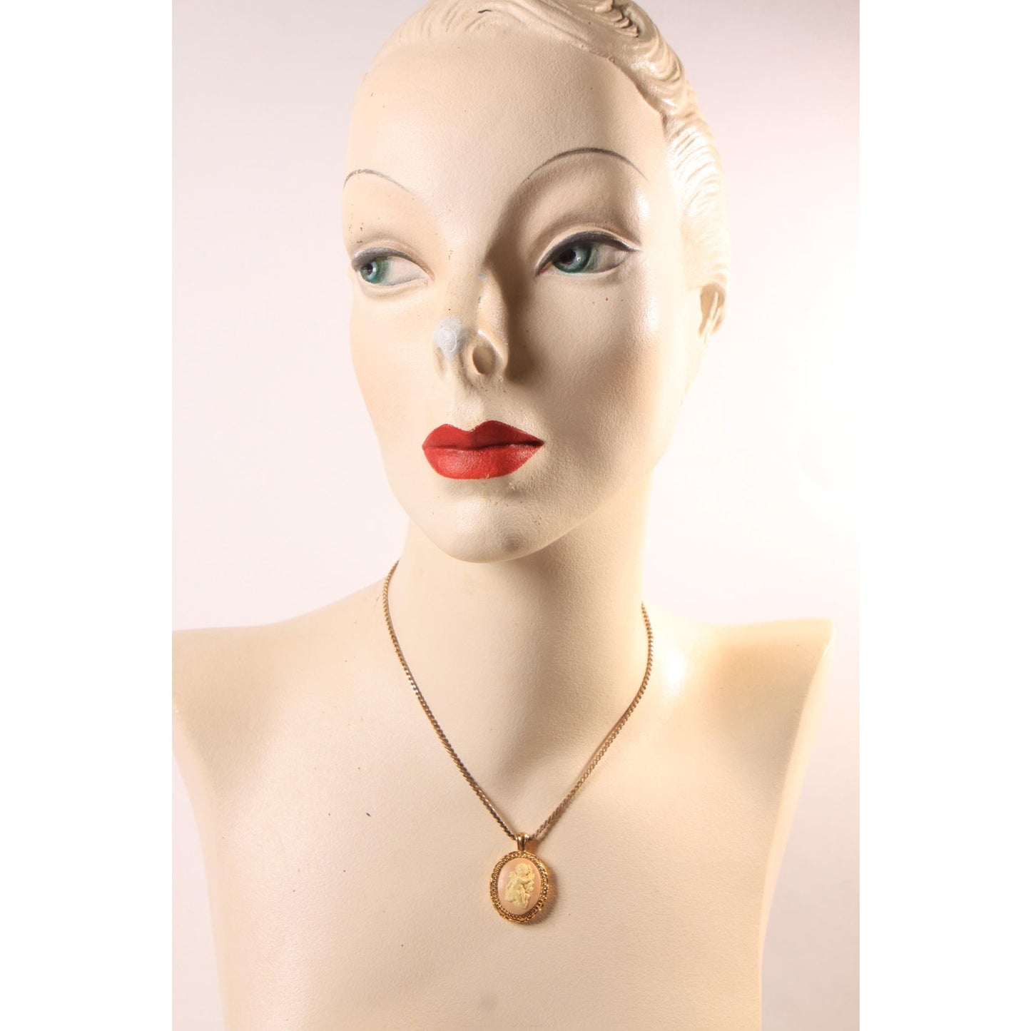 1970s Gold Tone Metal Pink and Cream Cherub Cameo Pendant Necklace