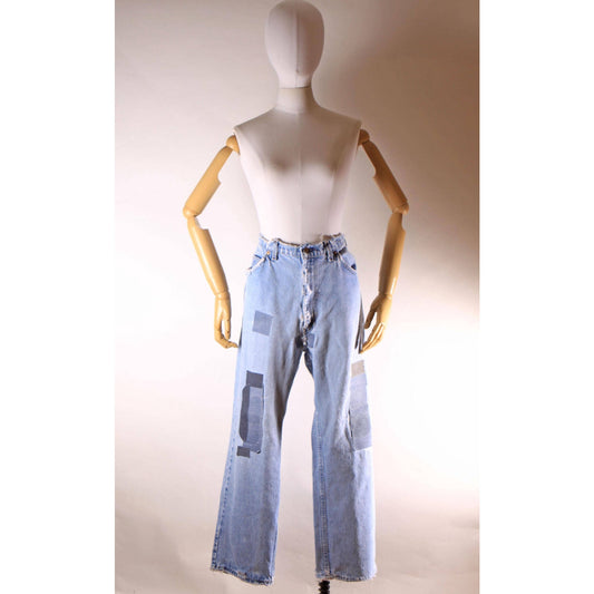 1980s Distressed Patch Fraying Blue Denim Orange Tab 517 Jeans by Levi's -38x29