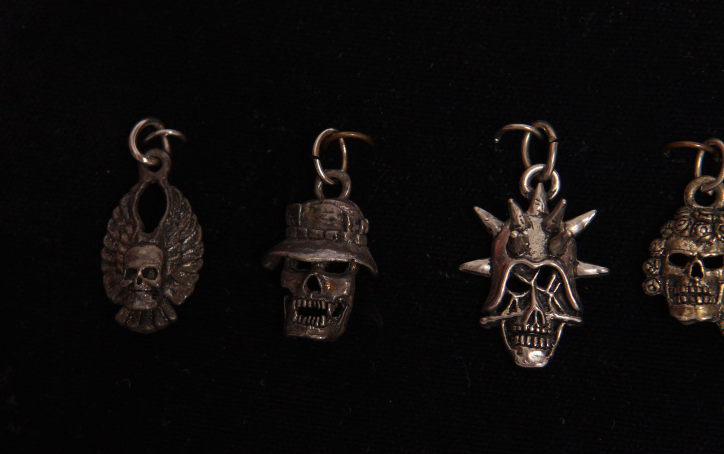 Deadstock 1980s Novelty Motorcycle Biker Pewter Skulls and Skeleton Hand Pendants