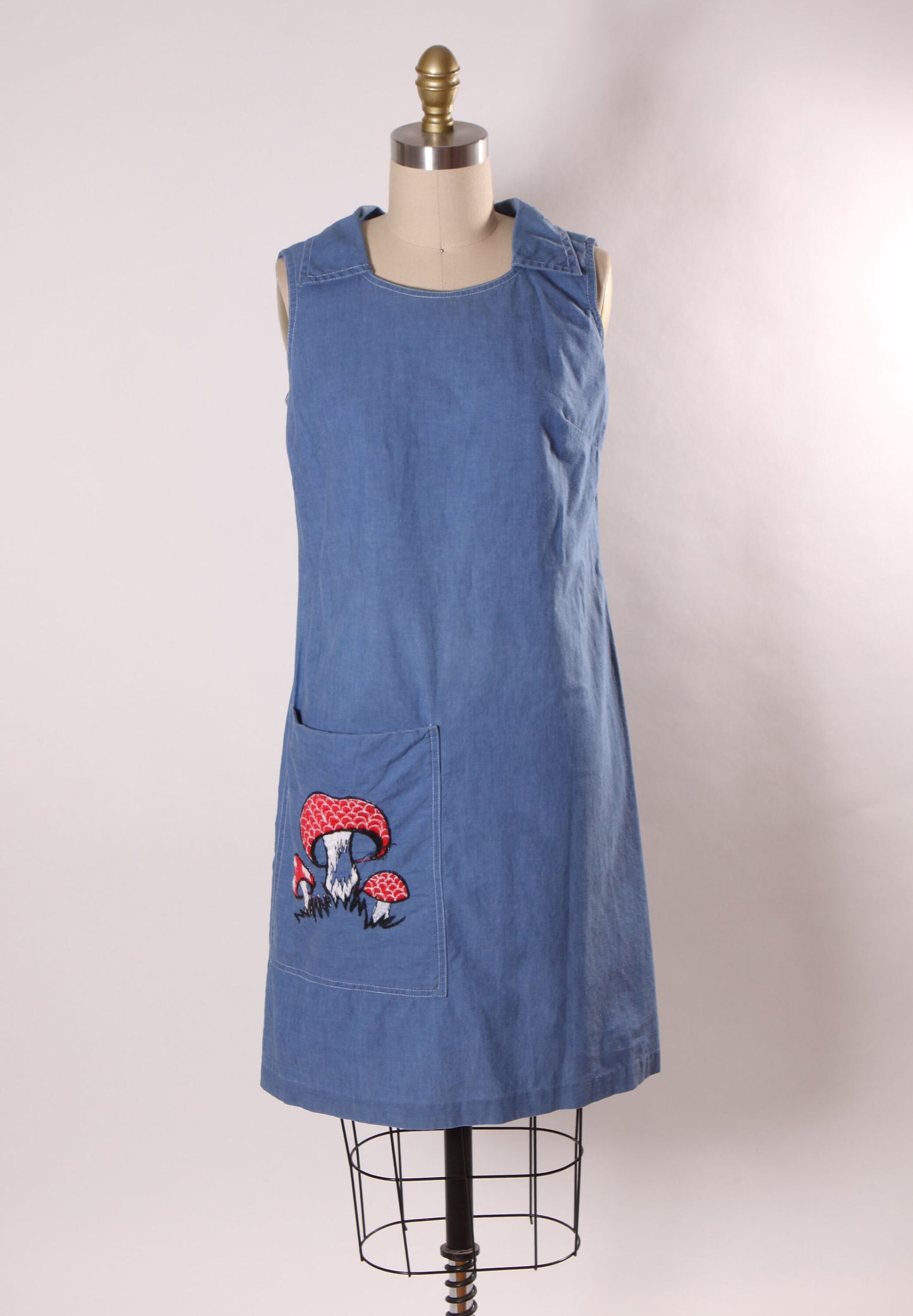 Late 1960s Early 1970s Denim Chambray Sleeveless Novelty Red Embroidered Mushroom Pocketed Dress by Loungecraft -S