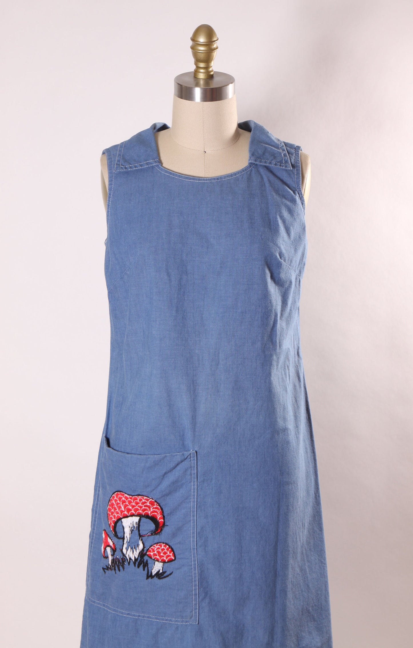 Late 1960s Early 1970s Denim Chambray Sleeveless Novelty Red Embroidered Mushroom Pocketed Dress by Loungecraft -S