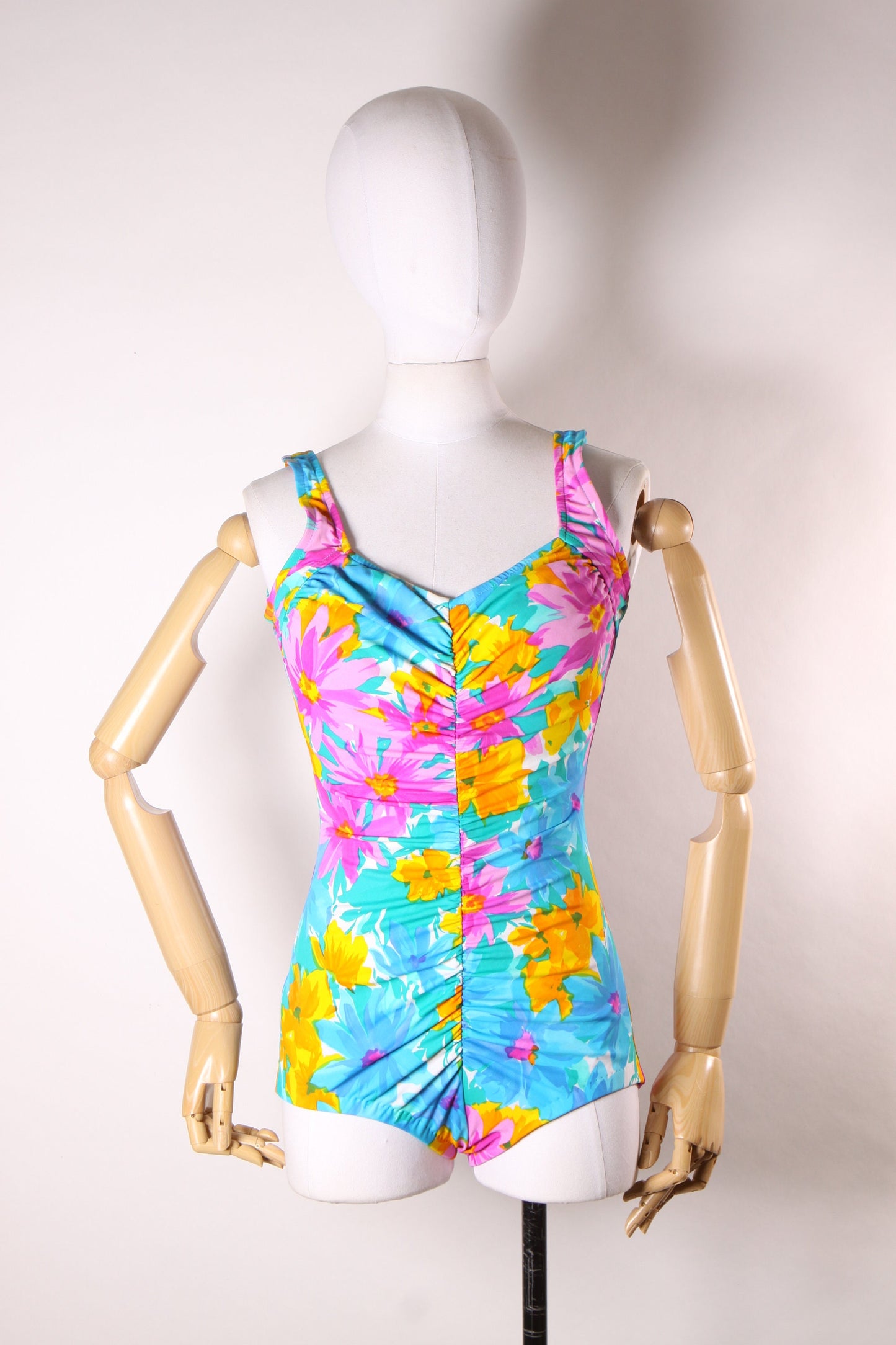 Late 1970s Early 1980s Blue, Pink and Orange Floral Ruched One Piece Swimsuit by Maxine of Hollywood -M-L