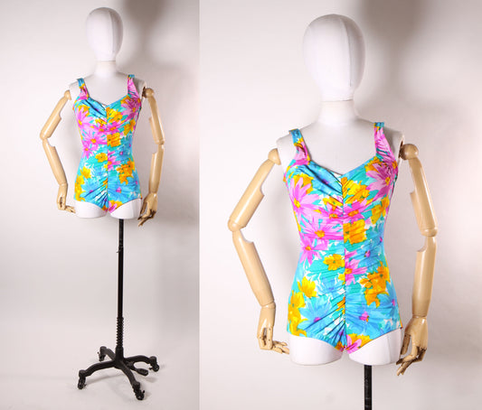 Late 1970s Early 1980s Blue, Pink and Orange Floral Ruched One Piece Swimsuit by Maxine of Hollywood -M-L